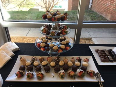 Chocolate strawberries on a plate and a three tear stand. Photo by Madison Weikle.