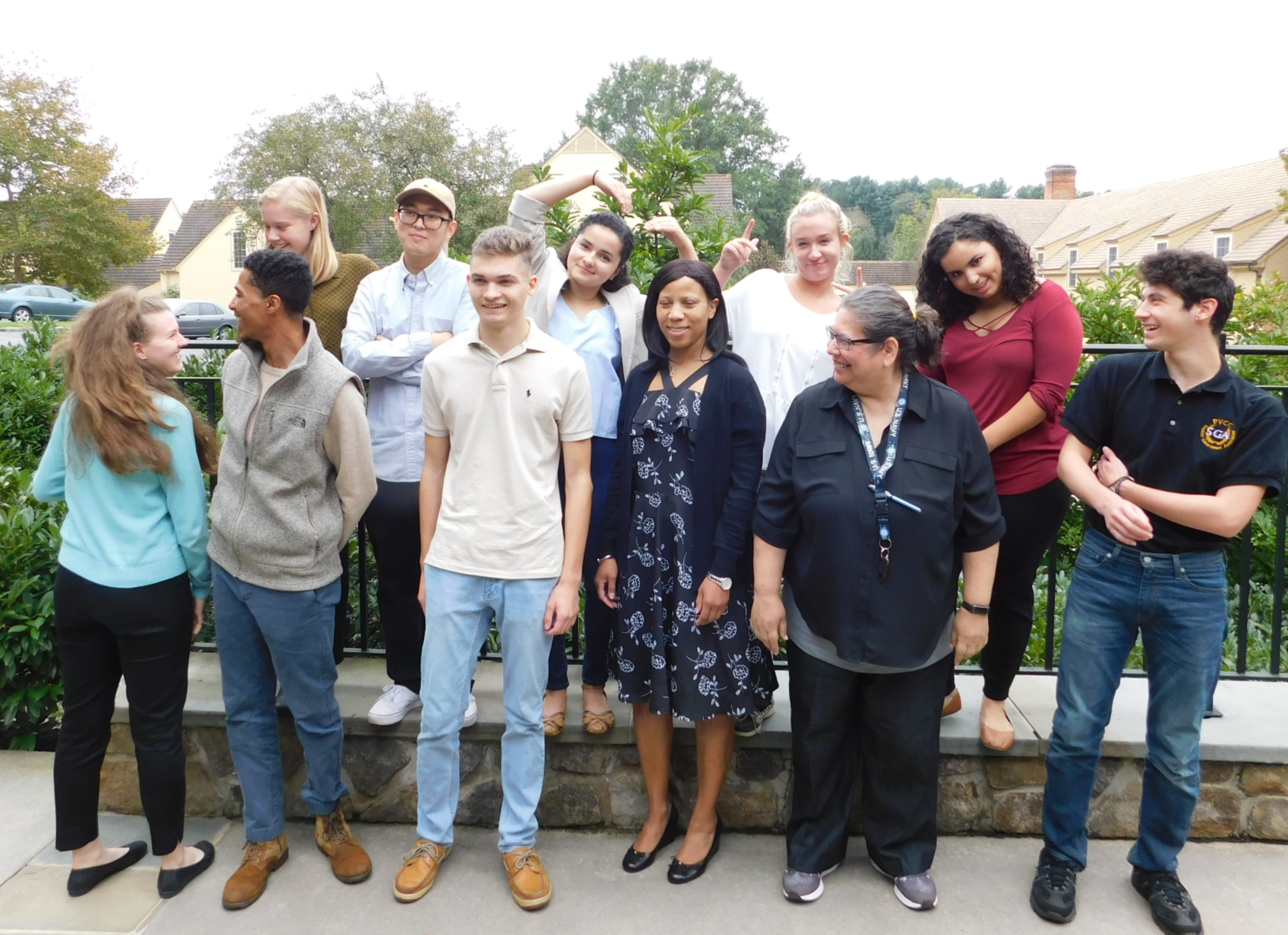 Students pose in silly ways outside