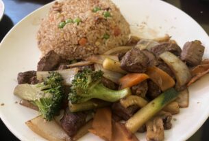 Hibachi Beef and Chicken Fried Rice sit decoratively on a white plate.