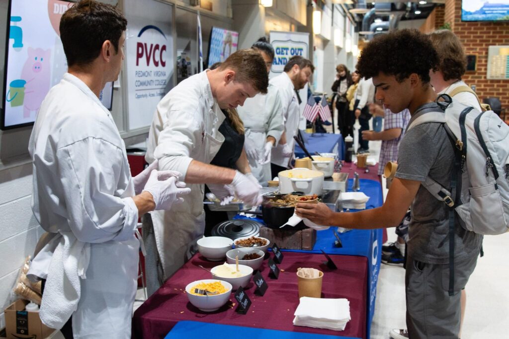 Culinary students feed PVCC students servings of grits.