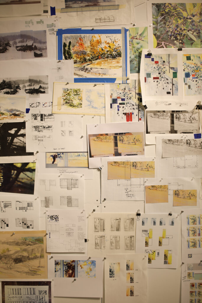 John Hancock’s design board for his various works, utilizing various nostalgic photos of fauna and landscaps, as well as organization demos of how the various tiles he paints line up.