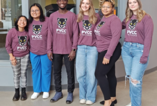 5 female students and 1 male student wearing PVCC Panther shirts pose in the Bolick Center.